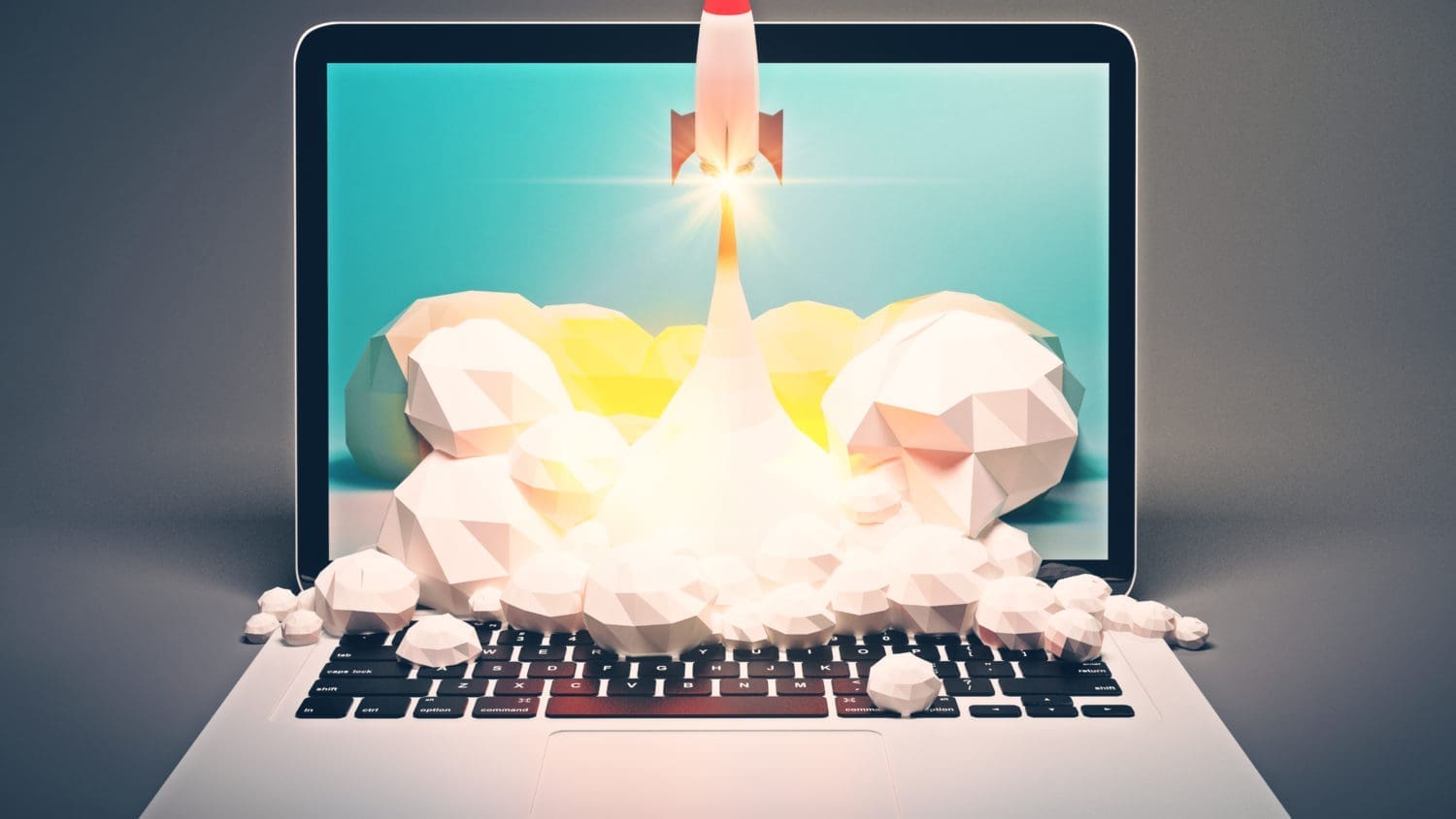 A laptop with a rocket coming out of it.