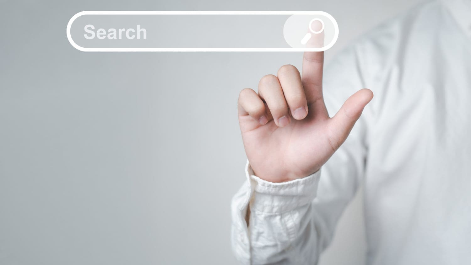 A man is pointing at a search button on a grey background, with an intention to bury negative search results.