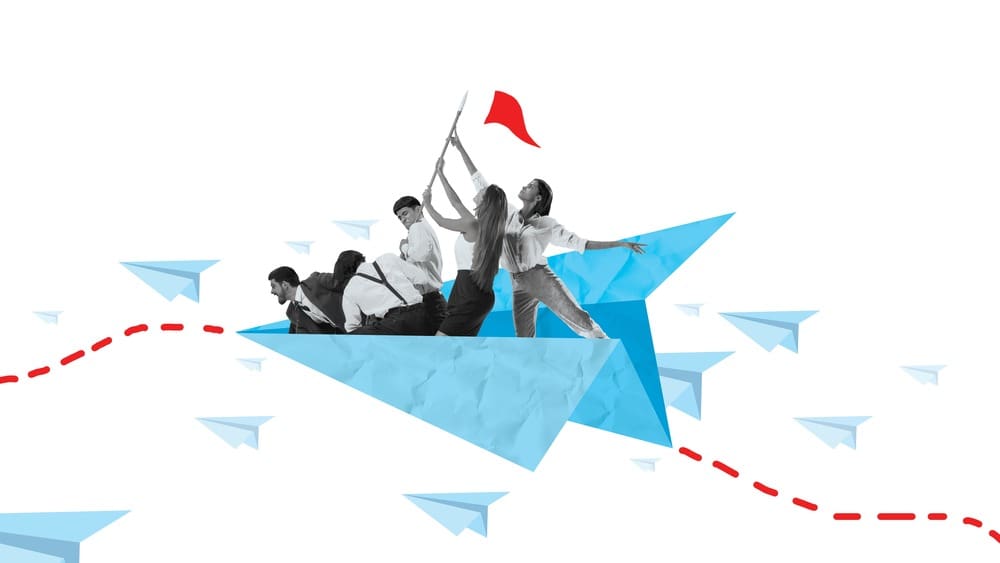 a group of people on a paper airplane.