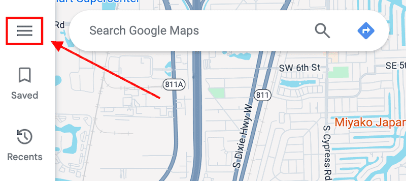 A screenshot of Google Maps showing a highlighted hamburger menu icon on the top left. An arrow points towards the icon. The map displays roads with labels like "S Dixie Hwy W" and nearby search results.