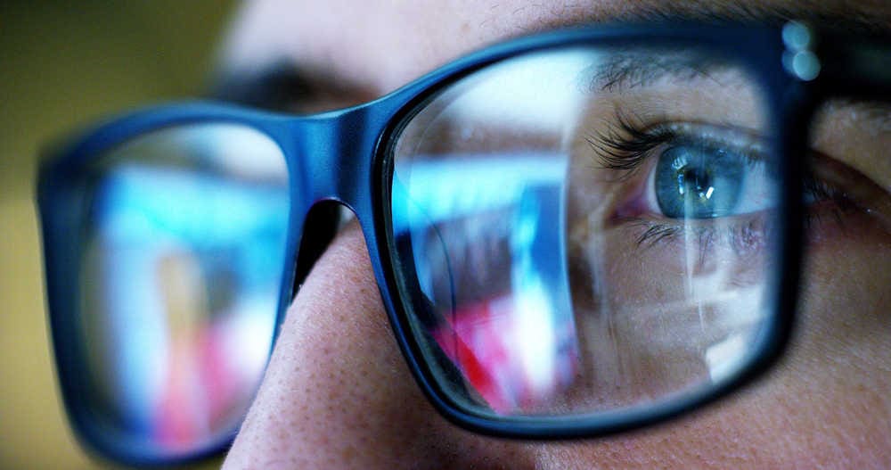 man looking with glasses at why is important to have a good online reputation