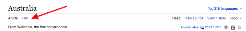 A red arrow points to the "Talk" tab next to the "Article" tab on the Wikipedia page for Australia, an important section to consult when learning how to create a Wikipedia page.