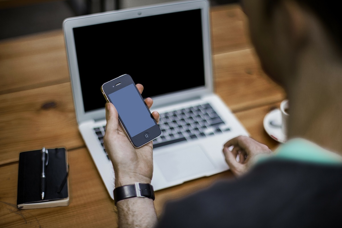 male looking at cell phone