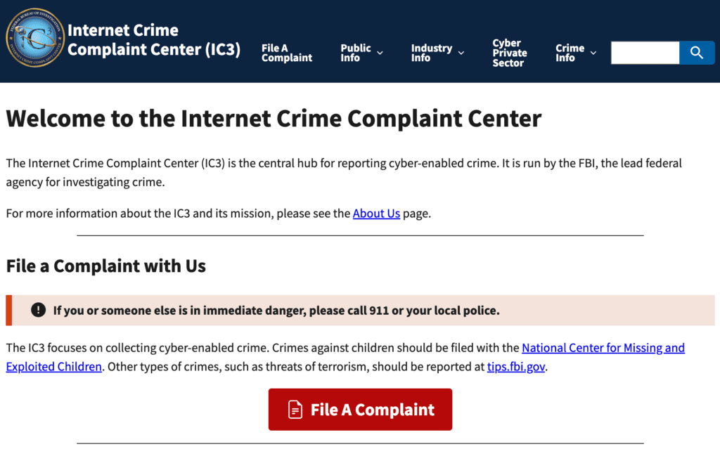 Screenshot of the Internet Crime Complaint Center (IC3) website homepage, showing a welcome message, emergency contact warning, information about filing complaints, and a large red "File A Complaint" button.