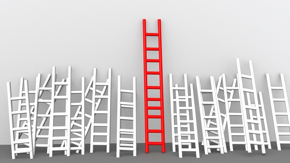 red ladder next to white ladders showcasing competitive advantage