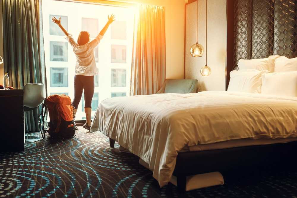 woman stretching in hotel room